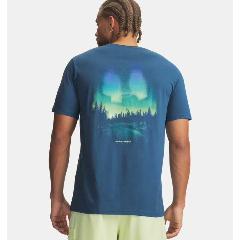Person wearing a blue t-shirt with a nature graphic on the back, standing against a white background. Willapa Outdoor