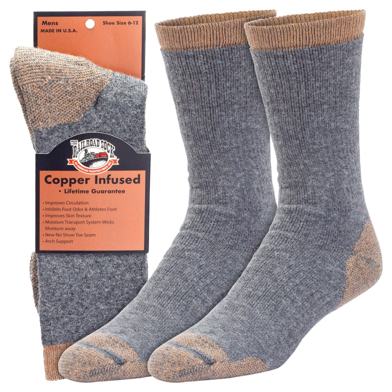 Pair of gray socks with brown accents and packaging on a white background