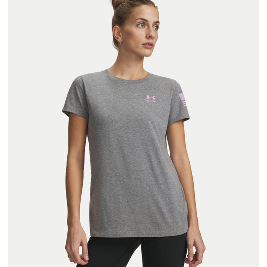 Woman wearing a gray Under Armour t-shirt with a logo on a white background. Willapa Outdoor